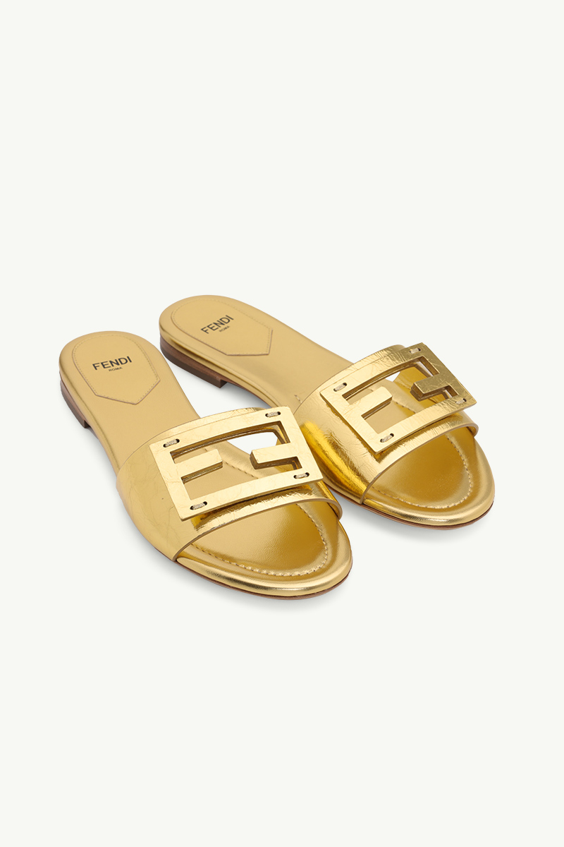 FENDI Women Siganture FF Baguette Slide Sandals in Gold Laminated Nappa Leather 1